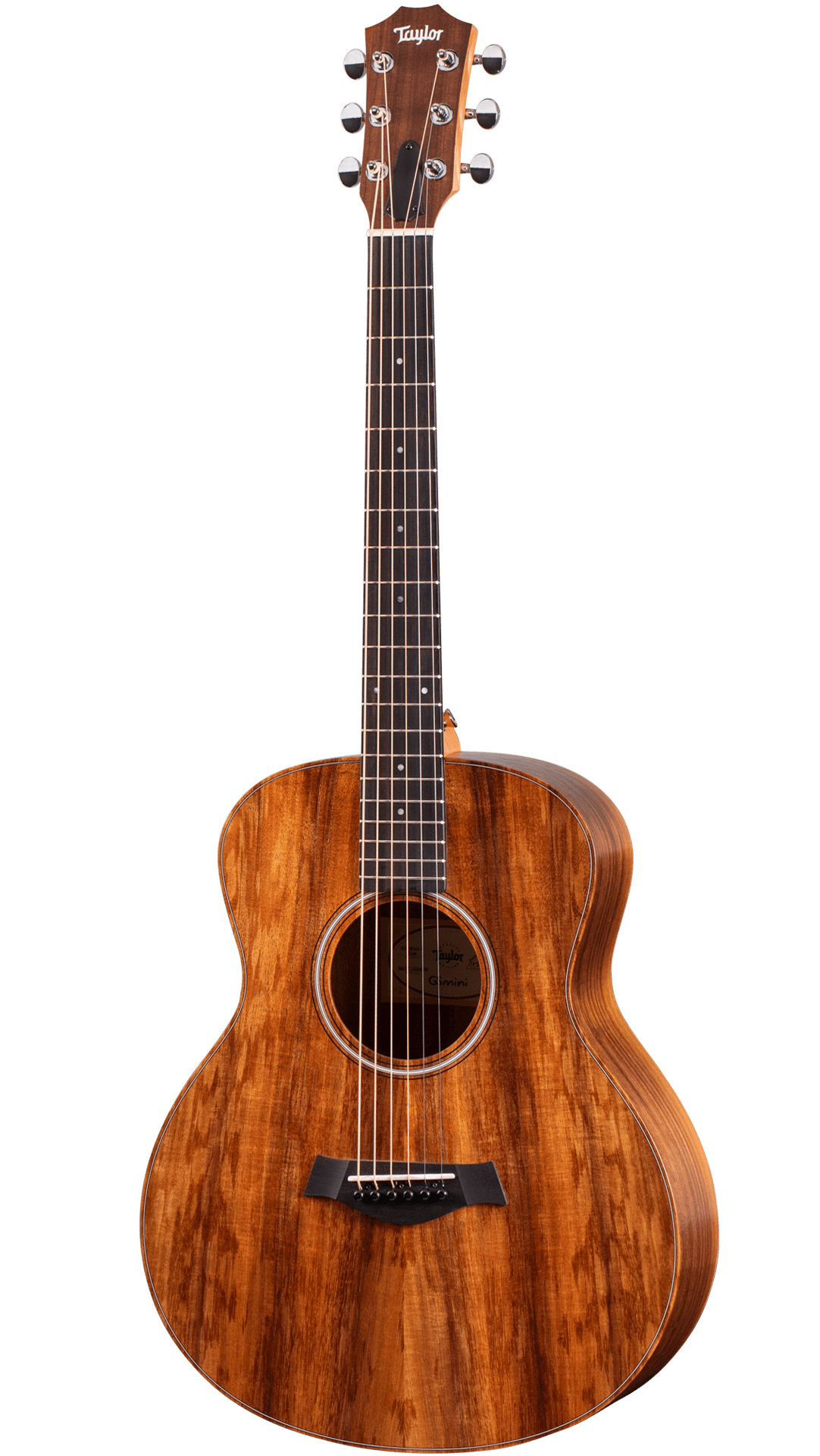 The image shows a beautiful Taylor steel-string acoustic guitar with a medium-sized Grand Auditorium body. It features a rich koa or mahogany wood grain with amber tones, chrome tuning machines, a dark wood bridge with a compensated saddle, a traditional round soundhole with a decorative rosette, and a dark ebony or rosewood fretboard with dot markers. This high-quality instrument is suited for recording, performing, or serious playing.