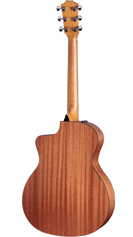 The image shows the back of an acoustic guitar with a warm-toned wood body, possibly mahogany, featuring visible grain patterns. It has a 3+3 tuning peg headstock, a long wooden neck, and a curved body with a cutaway design. The wood has a natural satin finish, with binding around the edges. This quality guitar appears suited for both acoustic and amplified play.