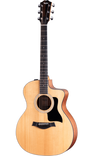 The image shows a Taylor acoustic guitar with a natural wood finish and cutaway design. It features a spruce top, darker mahogany-like back and sides, an ebony or rosewood fretboard with dot inlays, and a black pickguard. The headstock displays the Taylor logo, with chrome tuning pegs and steel strings. This model likely belongs to Taylor’s Grand Auditorium line, known for its clear tone and playability.