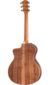 The image shows the back of a glossy acoustic-electric guitar with a warm wood grain finish, white body binding, and a cutaway design. It features six chrome tuning pegs in a 3+3 arrangement on the headstock and an output jack on the side. The guitar combines classic acoustic shape with quality materials and hardware, suitable for both unplugged and amplified playing.