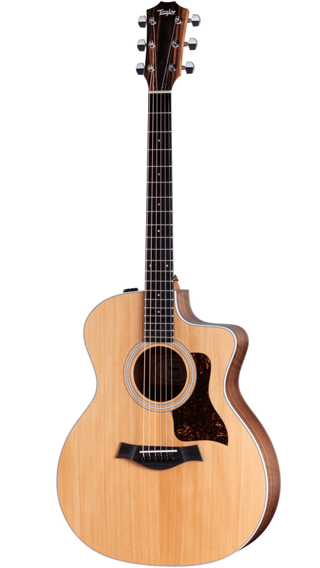The image shows a Taylor cutaway acoustic guitar with a natural light wood top and darker back and sides. It features a tortoiseshell pickguard, chrome tuning machines, an ebony fretboard with inlays, and a decorative sound hole rosette. The cutaway design allows easy access to higher frets. This high-quality guitar likely belongs to Taylor’s 200, 300, or 400 series, known for balanced tone and excellent craftsmanship.