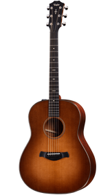 The image shows a beautiful Taylor acoustic steel-string guitar with a classic dreadnought body. It features a sunburst finish transitioning from amber center to dark edges, a light-colored spruce top, darker wood back and sides, chrome tuning pegs, black bridge, decorative fretboard inlays including a distinctive 12th fret pattern, and light binding around the body. The Taylor logo is visible on the headstock.