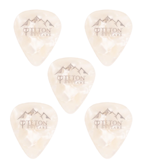 The image shows five translucent cream-colored guitar picks from Teton Guitars, each featuring the brand’s mountain range logo and text. Arranged scattered on a white background, these plectrums are accessories used for strumming or picking guitar strings.