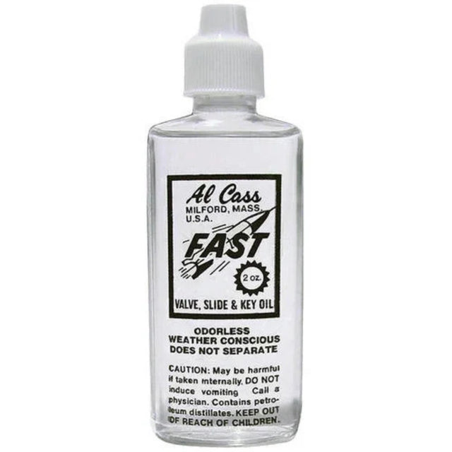 The image shows a 2-ounce bottle of Al Cass "FAST" valve, slide & key oil, a lubricant for brass instruments like trumpets, trombones, and tubas. Made in Milford, Massachusetts, it ensures smooth valve and slide action, is odorless, weather conscious, and stable. The label includes safety warnings about keeping it from children and avoiding ingestion. This oil is essential for maintaining brass instrument performance.