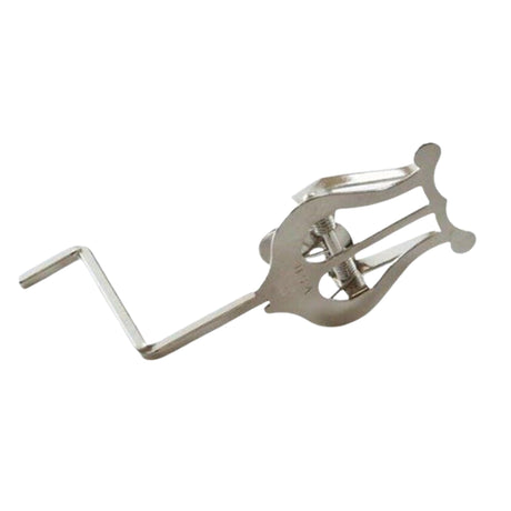 The image shows a metal saxophone ligature with a polished finish, featuring two thumbscrews for adjustable tension. It has a curved design that wraps around the mouthpiece in a classic traditional style. This essential accessory secures the reed to the mouthpiece, allowing musicians to control reed vibration and influence the instrument’s tone and response.