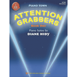 The image shows a piano music book cover titled "Attention Grabbers Book One" by Diane Hidy, part of the "Piano Town" series. It features a blue background with light beams, a red circular logo in the top left, and the title in large yellow letters. Published by Neil A. Kjos Music Company, it’s an elementary-level piano solos book (MP166) designed to engage young piano students.