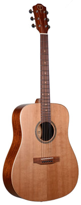 The image shows an acoustic guitar with a natural light wood top, darker wood back and sides, and a dreadnought body shape. It has six tuning pegs, a dark wood fretboard with inlays, steel strings, a round sound hole with a decorative rosette, and a wooden bridge. A logo is visible on the headstock. This classic design is versatile across genres and produces sound acoustically without amplification.