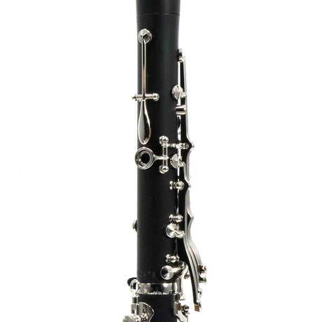 The image shows a section of a clarinet, a black woodwind instrument with silver-plated keys and tone holes. Visible are the intricate keywork and mechanisms that enable players to cover holes and produce notes chromatically across its wide range. This close-up highlights the craftsmanship and mechanical complexity that make the clarinet versatile and expressive in various musical settings.