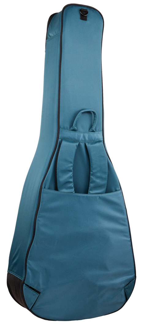 The image shows a teal blue guitar gig bag with black trim, featuring padded soft shell construction, a top carrying handle, a front accessory pocket with compartments, a full-length zipper, reinforced edges, and a shoulder strap attachment point. It’s a lightweight, portable case offering basic protection, popular for transporting acoustic or electric guitars to lessons, gigs, or practice.