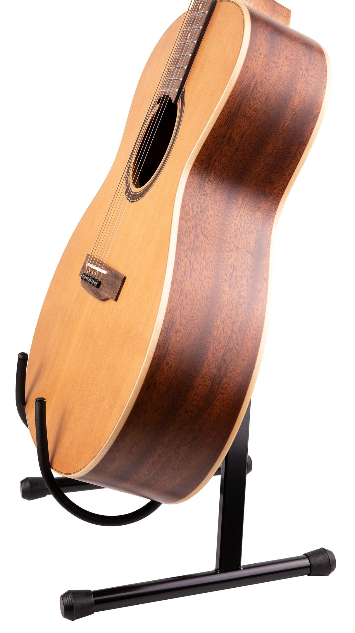 The image shows a classical nylon-string acoustic guitar on a black A-frame stand. It has a light spruce or cedar top, dark mahogany back and sides with rich grain, a round sound hole with a decorative rosette, a wooden neck and fretboard, and a wooden bridge with a bone or plastic saddle. The guitar’s traditional design highlights quality woods and craftsmanship for balanced sound and aesthetic appeal.