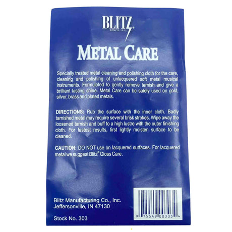 The image shows a Blitz Metal Care cloth (Stock No. 303) by Blitz, a brand established in 1912. This specialized two-part cloth is designed for cleaning and polishing unlacquered soft metal brass instruments like trumpets and trombones. Safe for gold, silver, brass, and plated metals, it removes tarnish and restores shine. The packaging warns against use on lacquered surfaces, recommending Blitz Gloss Care instead.