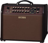 The image shows a BOSS Acoustic Singer Pro amplifier, designed for acoustic guitars and vocals. It features XLR and guitar inputs, EQ and effects controls (reverb, chorus, anti-feedback), harmony processing, and a built-in looper. The compact combo amp has a brown/bronze grille, carry handle, and a brown control panel with multiple knobs and LEDs, ideal for singer-songwriters and acoustic performers.