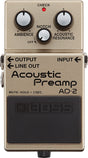 The image shows a Boss AD-2 Acoustic Preamp pedal for acoustic guitars. It features three control knobs: Ambience, Notch, and Acoustic Resonance. There is a red "CHECK" LED, labeled OUTPUT, INPUT, and LINE OUT jacks, and a large black footswitch with the Boss logo and "MUTE: HOLD > 2SEC" text. The pedal is champagne-colored and enhances acoustic tone with effects, feedback control, and resonance.