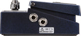 The image shows a guitar effects pedal’s side/back panel featuring two 1/4" audio jacks, a control knob, and a TRS Balanced Out label. It has a dark blue sparkle finish and sturdy metal construction. This high-quality pedal, likely for distortion or tone shaping, is designed for both live performance and studio use, indicating a boutique or premium build.