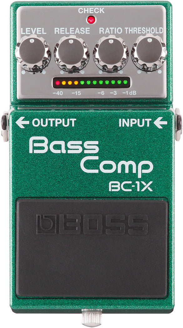 The image shows a Boss BC-1X Bass Comp, a green compressor pedal for bass guitars. It features four knobs (LEVEL, RELEASE, RATIO, THRESHOLD), a CHECK button with LED, and an LED meter (-40dB to -1dB) displaying compression levels. The pedal has input/output jacks, classic Boss design, and a black footswitch with the Boss logo. It provides dynamic compression for consistent bass tone and sustain, adapting to various playing styles.