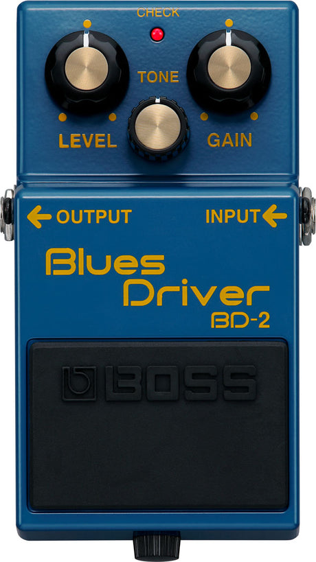 The image shows a Boss Blues Driver BD-2 guitar effects pedal, a popular overdrive/distortion pedal. It features three knobs (LEVEL, TONE, GAIN), a red "CHECK" LED, input/output jacks, and a blue housing with a black footswitch. Known for its warm, tube-like overdrive, the BD-2 is favored for blues, rock, and versatile guitar tones.