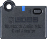 The image shows a BOSS Bluetooth Audio MIDI Dual Adaptor, a compact, dark gray device with BOSS branding, Bluetooth symbol, blue accent strip, power button, and mounting hole. It wirelessly transmits audio and MIDI data, enabling musicians to connect instruments to speakers, apps, or devices for practice, recording, or performance, blending modern wireless tech with reliable musical gear.