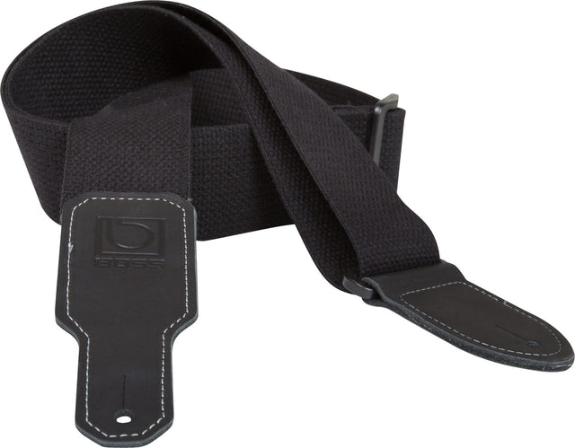 The image shows a black guitar strap made of durable fabric with a wide, padded shoulder section for comfort. It features adjustable metal buckles, leather or synthetic leather end tabs with white contrast stitching, and a visible BOSS logo on one end. Designed to support the instrument while standing, this versatile strap combines functionality and style, suitable for various guitar styles and performance settings.