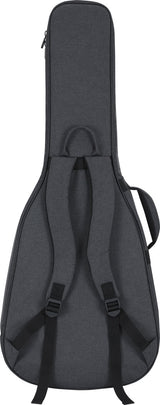 The image shows a dark gray padded guitar gig bag with a shape matching an acoustic or electric guitar. It features dual backpack straps, a top handle, a zippered closure, and an external accessory pocket. Designed for lightweight protection and easy transport, it’s popular among musicians needing portable, convenient storage for their instrument and small gear.