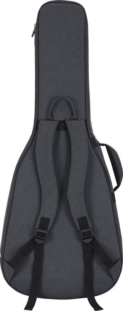 The image shows a dark gray padded guitar gig bag with a shape matching an acoustic or electric guitar. It features dual backpack straps, a top handle, a zippered closure, and an external accessory pocket. Designed for lightweight protection and easy transport, it’s popular among musicians needing portable, convenient storage for their instrument and small gear.