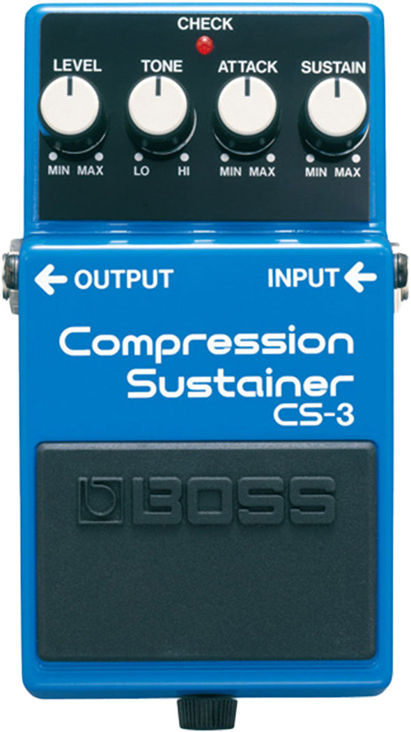 The image shows a blue BOSS CS-3 Compression Sustainer guitar effects pedal. It has four knobs—LEVEL, TONE, ATTACK, and SUSTAIN—for controlling volume, tone, compression attack, and sustain. A red "CHECK" LED lights when active. Input and output jacks are on the sides, and a large black footswitch with the BOSS logo turns the effect on/off. It compresses the guitar signal to even volume and add sustain.