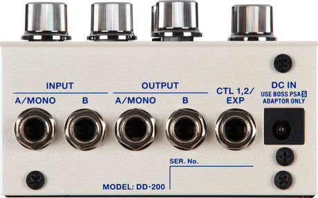 The image shows a Model DD-200 guitar effects pedal, a digital delay unit. It features four chrome control knobs, stereo A/MONO and B input/output jacks, CTL 1,2/EXP jack for external control, and a DC IN power jack. The pedal has a white/cream metal enclosure with blue labeling, designed for advanced delay effects with extensive parameter control and professional build quality.