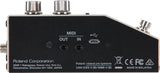 The image shows the back panel of a Roland audio interface featuring MIDI IN/OUT (5-pin DIN), USB and micro-USB ports, and audio input/output connections. It has a compact black design with silver knobs, marked with Roland branding, "Made in Malaysia," regulatory logos (CE, FCC), and patent info. This device connects MIDI instruments and audio sources to computers, ideal for musicians and producers bridging traditional gear with modern setups.
