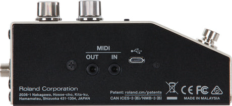 The image shows the back panel of a Roland audio interface featuring MIDI IN/OUT (5-pin DIN), USB and micro-USB ports, and audio input/output connections. It has a compact black design with silver knobs, marked with Roland branding, "Made in Malaysia," regulatory logos (CE, FCC), and patent info. This device connects MIDI instruments and audio sources to computers, ideal for musicians and producers bridging traditional gear with modern setups.