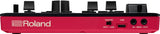 The image shows the front panel of a Roland electronic music device with a red casing and white logo. It features multiple black knobs and buttons, a POWER switch, a USB port, and MIDI IN/OUT connections. The design and controls suggest it is a synthesizer, drum machine, or music controller used for live performance and studio production.