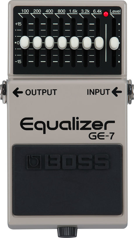 The image shows a Boss GE-7 Equalizer pedal, a popular 7-band guitar effects pedal with sliders for 100Hz to 6.4kHz frequencies, each adjustable ±15dB. It includes a master Level control, 1/4" input/output jacks, and a classic gray/silver casing. Used by guitarists and bassists to shape tone, reduce feedback, and boost frequencies for live and studio settings.