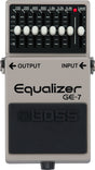 The image shows a Boss GE-7 Equalizer pedal, a popular 7-band guitar effects pedal with sliders for 100Hz to 6.4kHz frequencies, each adjustable ±15dB. It includes a master Level control, 1/4" input/output jacks, and a classic gray/silver casing. Used by guitarists and bassists to shape tone, reduce feedback, and boost frequencies for live and studio settings.