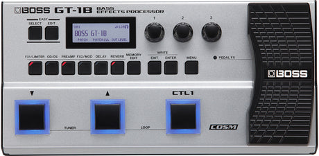 The image shows a Boss GT-1B Bass Effects Processor, a multi-effects pedal for bass guitars. It features an LCD display, Easy Select/Edit buttons, three rotary knobs, and multiple effect buttons like FX1, OD/DS, Preamp, Delay, and Reverb. There are three footswitches with blue LEDs, write/edit buttons, a textured expression pedal, and COSM technology branding, offering versatile effects and amp simulation in a compact unit.