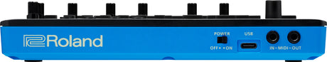 The image shows a bright blue Roland electronic music device, likely a synthesizer or keyboard workstation. It features six black rotary knobs, a power switch, a USB port, and two MIDI ports labeled "IN-MIDI-OUT." The professional design suggests use for music production, live performance, and sound design. Roland is a reputable brand known for electronic instruments with modern connectivity options.