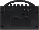 The image shows the back panel of a BOSS Katana Mini (KTN-MINI) guitar amplifier, featuring AUX IN and PHONES/REC OUT jacks, a DC power input, a USB port, ventilation holes, regulatory labels, and rubber feet. This compact amplifier supports silent practice with headphones, playing along via auxiliary input, and USB connectivity for recording or updates.