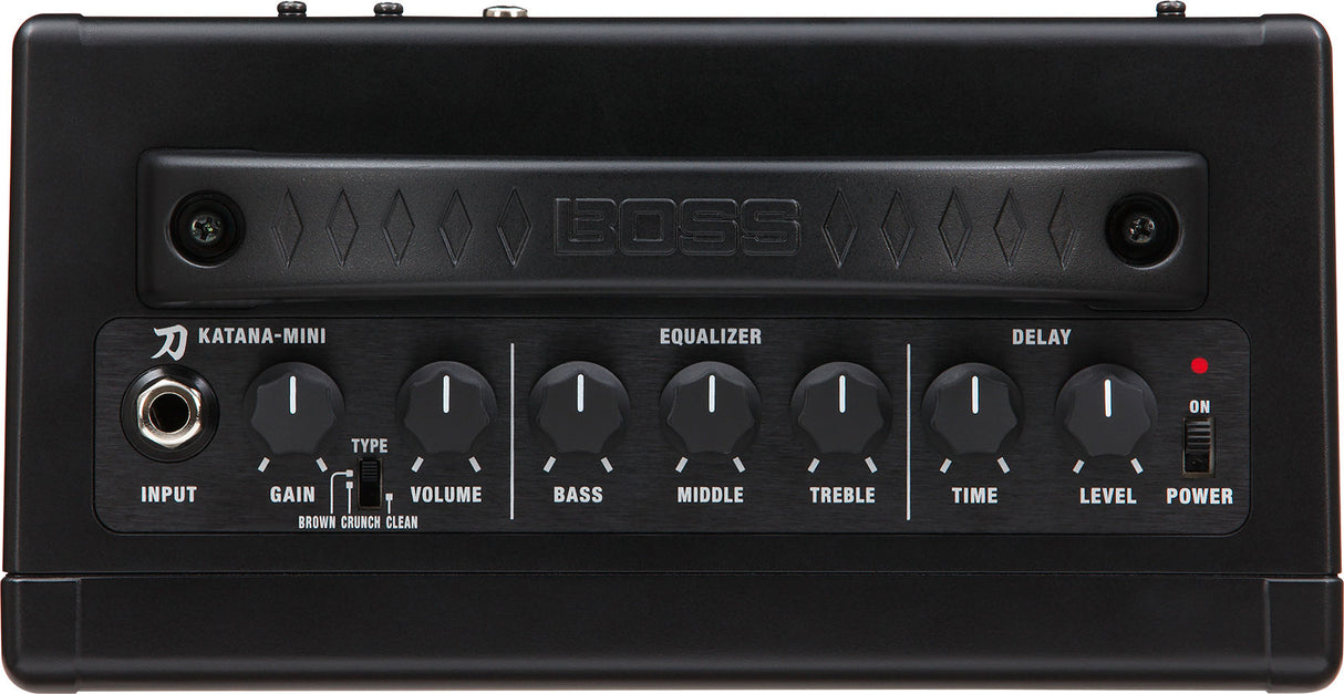 The image shows a BOSS Katana-Mini guitar amplifier, a compact, portable electric guitar amp. It features an input jack, gain control with toggle for Brown, Crunch, and Clean amp types, volume control, 3-band EQ (Bass, Middle, Treble), built-in delay effect with Time and Level controls, and a power switch with LED. This battery-powered amp delivers versatile, tube-like tones, ideal for practice or small performances.