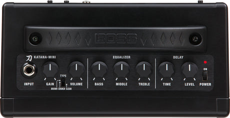 The image shows a BOSS Katana-Mini guitar amplifier, a compact, portable electric guitar amp. It features an input jack, gain control with toggle for Brown, Crunch, and Clean amp types, volume control, 3-band EQ (Bass, Middle, Treble), built-in delay effect with Time and Level controls, and a power switch with LED. This battery-powered amp delivers versatile, tube-like tones, ideal for practice or small performances.