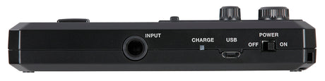 The image shows a black electronic music device, likely a guitar effects pedal or multi-effects processor. It features an INPUT jack on the left, a USB port, a CHARGE indicator, a POWER switch on the right, two control knobs on top, and a footswitch button. It is rechargeable and designed for musicians to add sound effects, with USB connectivity for updates or recording.