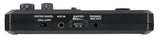 The image shows a compact, black audio effects pedal with two large knobs, a "CENTER CANCEL" switch, an "AUX IN" jack, a "MASTER" level knob, and a "PHONES/REC OUT" jack. White labels identify controls on its rectangular housing. It appears to be a vocal or karaoke processor designed to reduce lead vocals and support practice, recording, or performance with various audio sources.