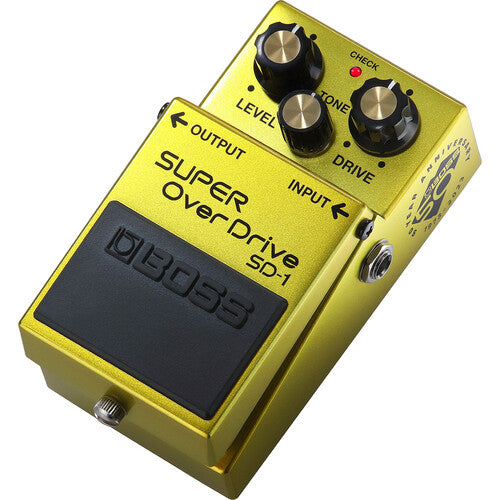 The image shows a Boss SD-1 Super OverDrive guitar pedal with a bright yellow metal housing. It features three control knobs (Level, Tone, Drive), input/output jacks on the sides, a large footswitch, and visible Boss branding. Known for adding warmth, sustain, and mild to moderate distortion, the SD-1 is a classic, versatile overdrive used in blues, rock, and more by amateur and professional guitarists.