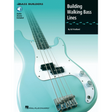Book cover of 'Building Walking Bass Lines' by Ed Friedland with a bass guitar illustration on a light blue background.