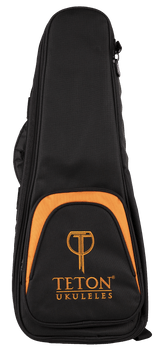 The image shows a Teton Music ukulele gig bag in black with orange trim. It features a padded, soft-sided design with a zippered closure and a front pocket displaying the "TETON UKULELES" logo. The bag has a teardrop shape tailored for a ukulele, providing lightweight protection and convenient storage for transporting the instrument.