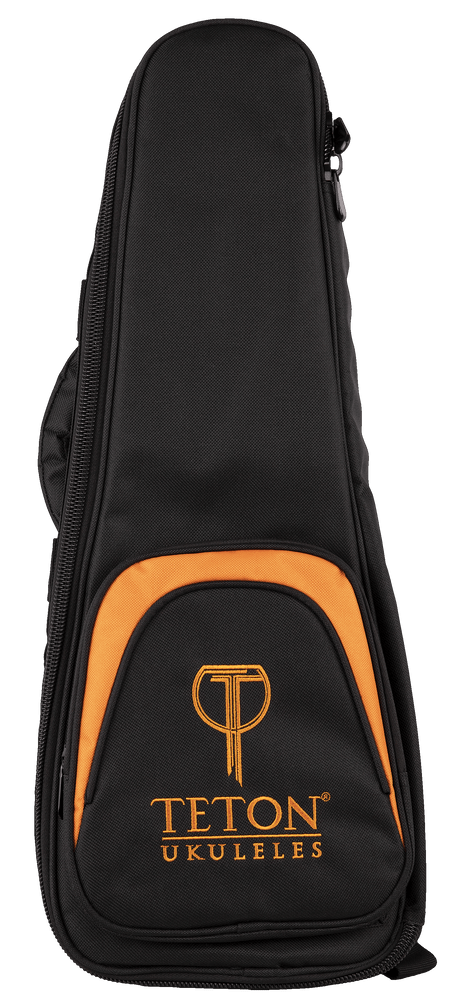 The image shows a Teton Music ukulele gig bag in black with orange trim. It features a padded, soft-sided design with a zippered closure and a front pocket displaying the "TETON UKULELES" logo. The bag has a teardrop shape tailored for a ukulele, providing lightweight protection and convenient storage for transporting the instrument.