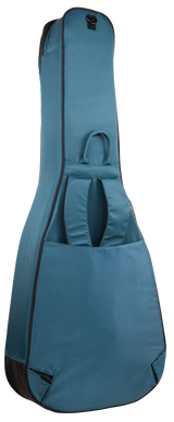 The image shows a teal/blue-green guitar gig bag designed for acoustic or electric guitars. It has a padded soft shell, dark trim, a front pocket with handles for accessories, backpack-style shoulder straps, a top handle, and a full-length zipper. Lightweight and portable, it offers convenient protection for musicians transporting their instruments to lessons, gigs, or practice sessions.
