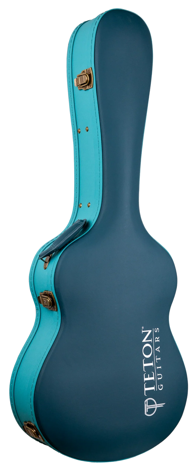 The image shows a hard shell guitar case from Teton Guitars in a teal/turquoise color with gold metal hardware. It features the classic acoustic guitar shape and the "TETON GUITARS" logo in white. Designed for protection, this sturdy case offers secure storage and transport, shielding acoustic guitars from impacts and environmental damage better than soft gig bags.