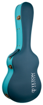 The image shows a hard shell guitar case from Teton Guitars in a teal/turquoise color with gold metal hardware. It features the classic acoustic guitar shape and the "TETON GUITARS" logo in white. Designed for protection, this sturdy case offers secure storage and transport, shielding acoustic guitars from impacts and environmental damage better than soft gig bags.