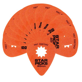 The image shows a set of bright orange "STAR PICKS" guitar picks with a .60mm thickness. Each pick has a traditional teardrop shape and a unique star-shaped cutout in the center. The patent number 5587542 is visible on the picks. They are fanned out to display multiple pieces, highlighting their specialty design that may enhance grip or playing feel compared to standard solid picks.