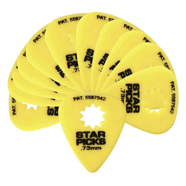 The image shows a fan-like arrangement of yellow "Star Picks" guitar picks, each 0.73mm thick with a distinctive star-shaped cutout in the center. Patent number 5587542 is printed on them. The star-shaped hole is a unique patented feature designed to improve grip and control, making these picks a specialized accessory in the musical instrument industry.