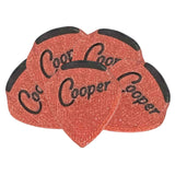 The image shows a set of teardrop-shaped Coor Cooper guitar picks with a reddish-orange sparkled finish and black decorative edges. The brand name "Coor Cooper" is printed in black on each pick. These visually striking picks are used by guitarists for plucking or strumming strings and serve as both practical playing tools and collectible items.