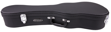 The image shows a black Teton ukulele hard case with a classic guitar-like shape but smaller size. It has a textured exterior, chrome corner protectors and latches, a central black handle, and the "TETON" logo. The case features reinforced corners and secure latches, offering durable protection and portability for ukuleles.