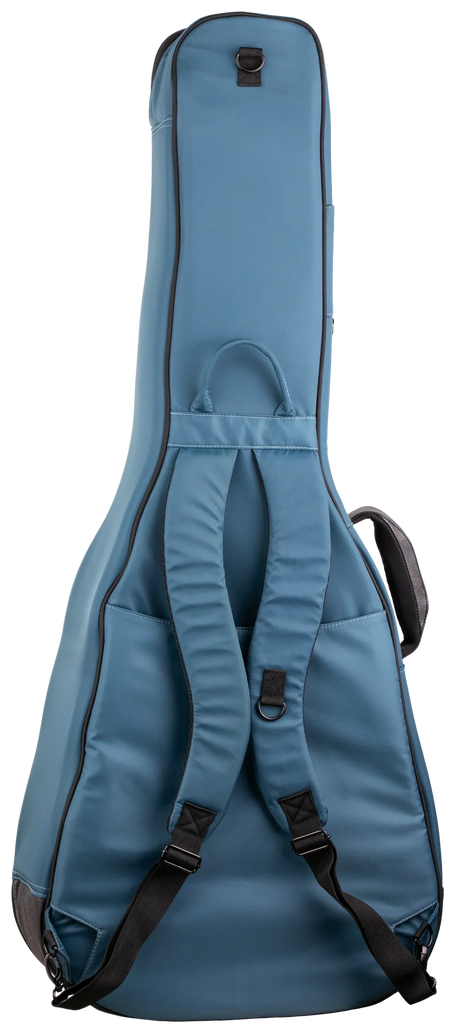 The image shows a steel blue/teal guitar gig bag with a padded, guitar-shaped design for acoustic or electric guitars. It features black trim, dual backpack-style straps, a top handle, a front accessory pocket, heavy-duty zippers, reinforced areas, and D-rings for durability. This lightweight, protective soft case is ideal for transporting guitars to gigs, lessons, or practice.